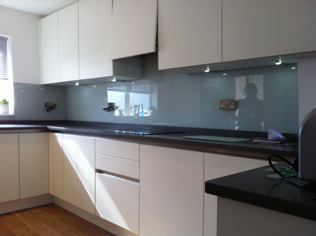 Grey glass kitchen splashback with LED lighting in North Finchley