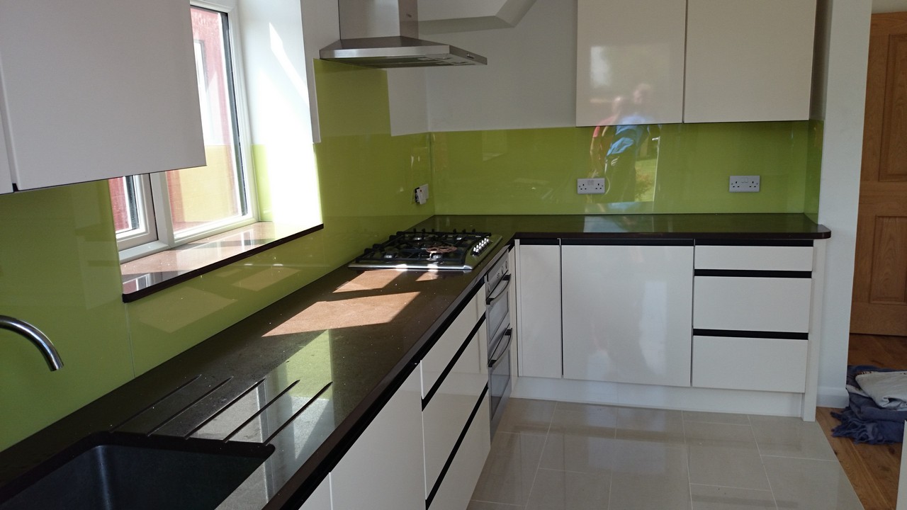 Lime green glass kitchen splashback installed by North Finchley glaziers