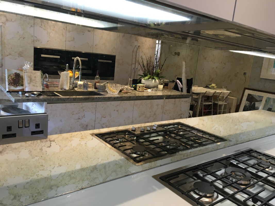 Mirror glass splashback in North Finchley luxury kitchen