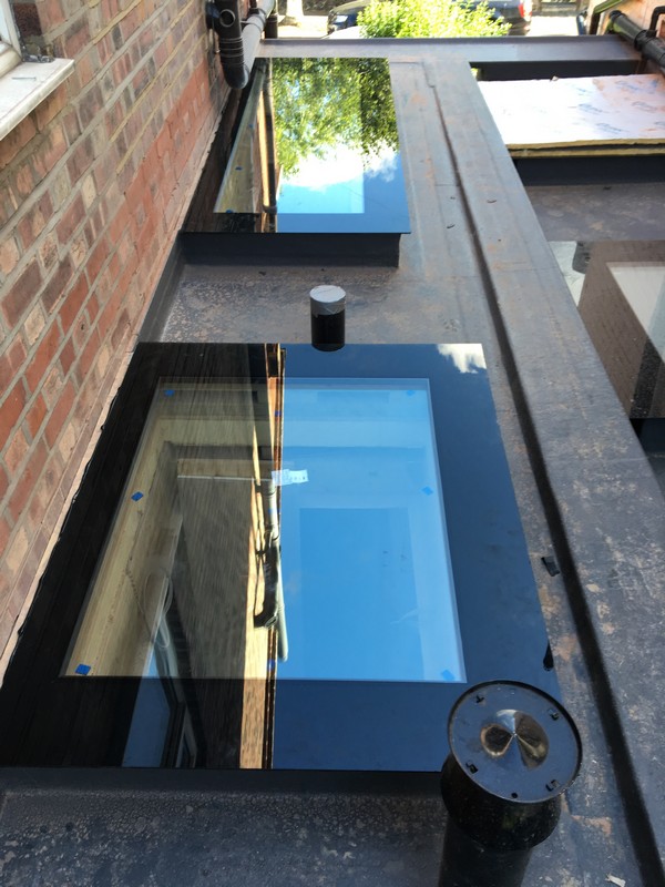 Multiple flat roof skylights on extension in North Finchley