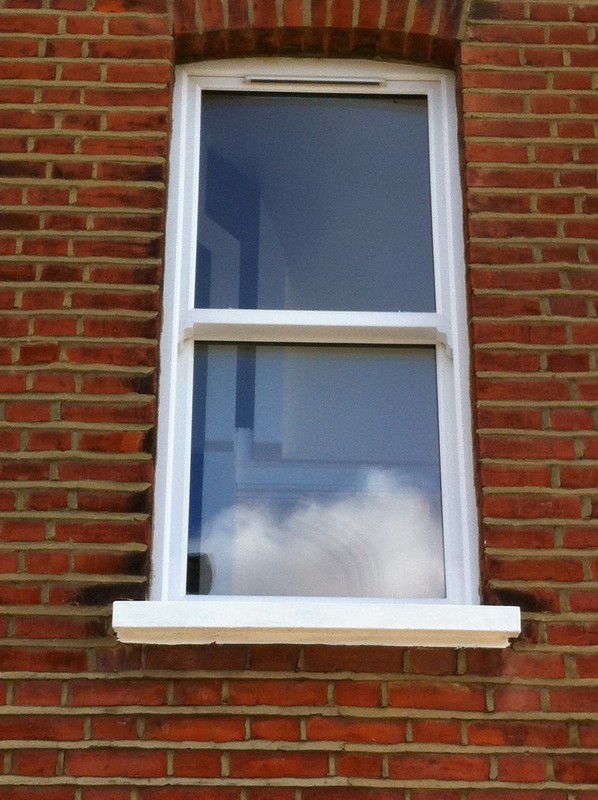 uPVC sash window on Victorian red brick house in North Finchley